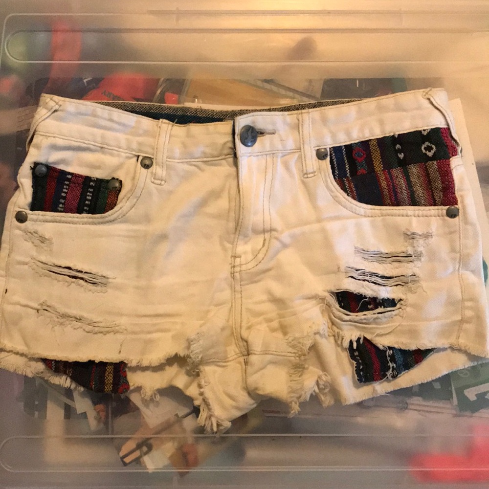 Free People white jean shorts.
